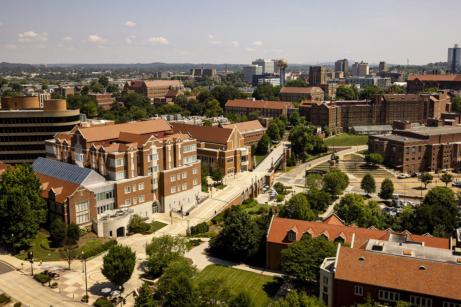 An overview of campus and Downtown Knoxville from the top of McClung Tower with Ped Walkway, Ayres Hall and the Sunsphere in the foreground.