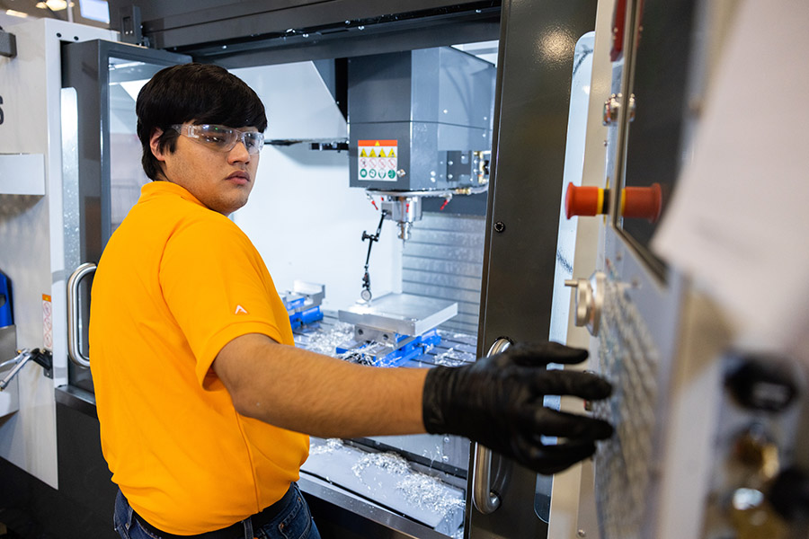 Ryan Garcia machines the top left quadrant of the SEC logo made by UT’s team during the inaugural SEC Machining Competition held at the University of Tennessee’s new Manufacturing and Design Enterprise in Hardin Valley, Tennessee.