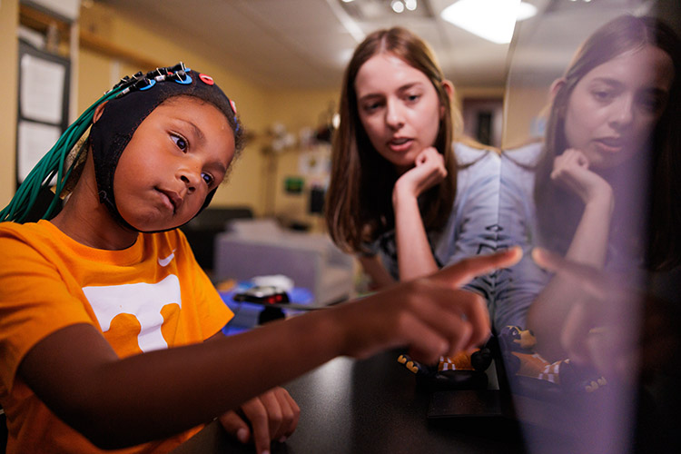 Alexis McCraw, 3rd year Phd student in Experimental Psychology, uses computer games to stimulate a minor’s brain waves in the Attention, Brain, and Cognition Lab in the Austin Peay Building at the University of Tennessee, Knoxville.