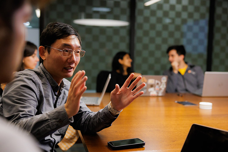 Charles Liu, associate professor of business analytics and statistics, leads a research session with his students in Stokely Management Center at the University of Tennessee.