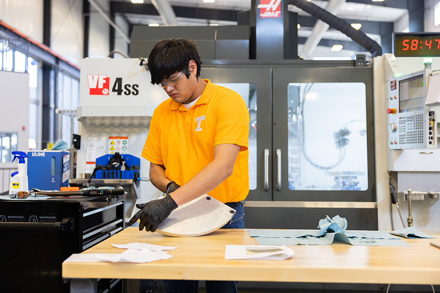 Ryan Garcia machines the top left quadrant of the SEC logo made by UT’s team during the inaugural SEC Machining Competition held at the University of Tennessee’s new Manufacturing and Design Enterprise in Hardin Valley, Tennessee.