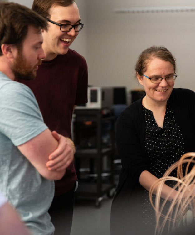 Catherine Schumann helping students in her Neomorphic Computing Lab.