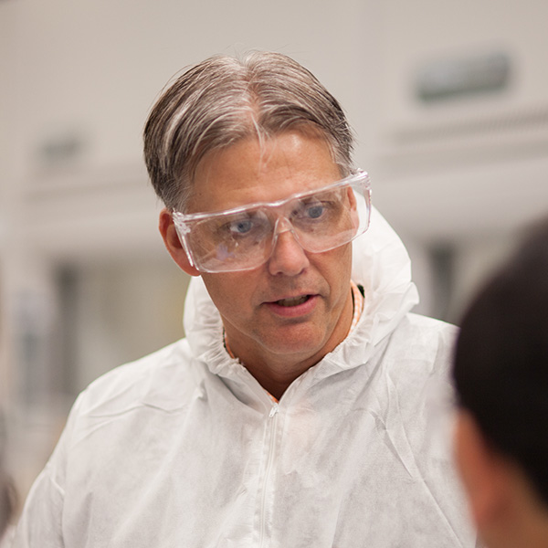 Brian Wirth wears safety goggles in a lab.