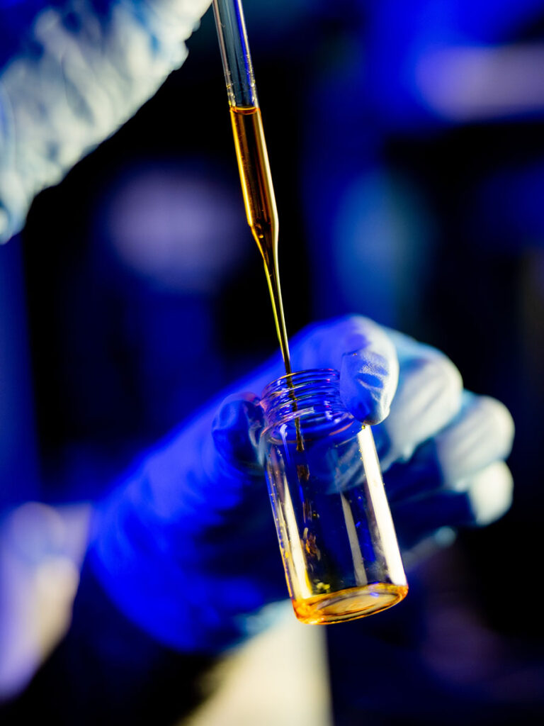 A graduate student works in the Polymer Characterization Laboratory at the University of Tennessee.