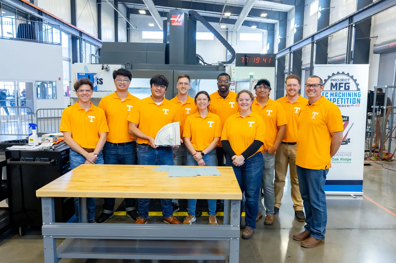 The UT student team and Professor Tony Schmitz gather around their entry to the inaugural SEC Machining Competition.
