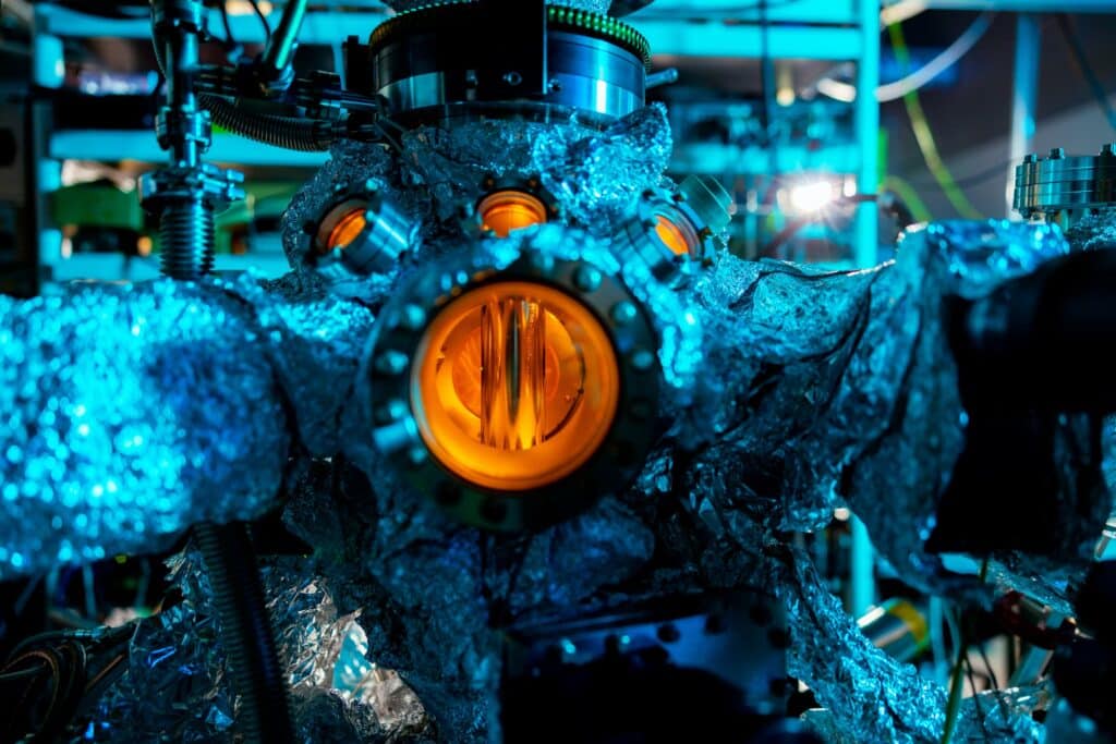 The Advanced Photoelectron Spectrometer covered in foil with one window lit orange.