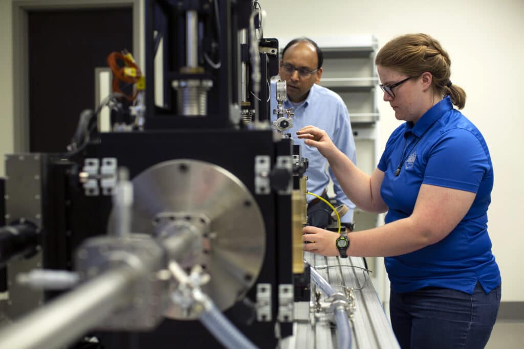 Professor Dayakar Penumadu and doctoral candidate Hannah Maeser work in UT's Fibers and Composites Manufacturing Facility.
