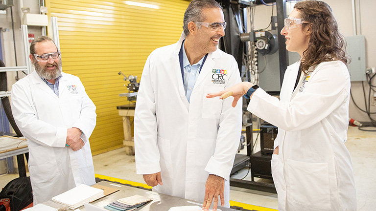 Cecile Grubb explains her research to a Volkswagen executive during a campus visit.