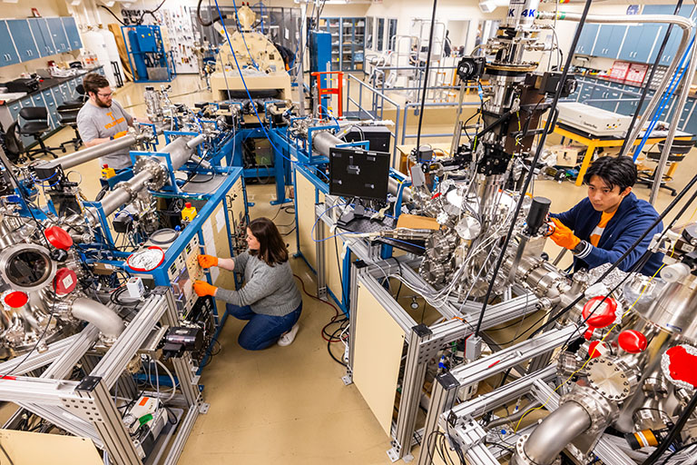 Several graduate students work in the Ion Beam Materials Laboratory.