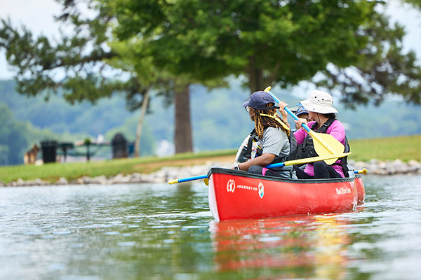 A couple paddles a kayak on the Tennessee River.