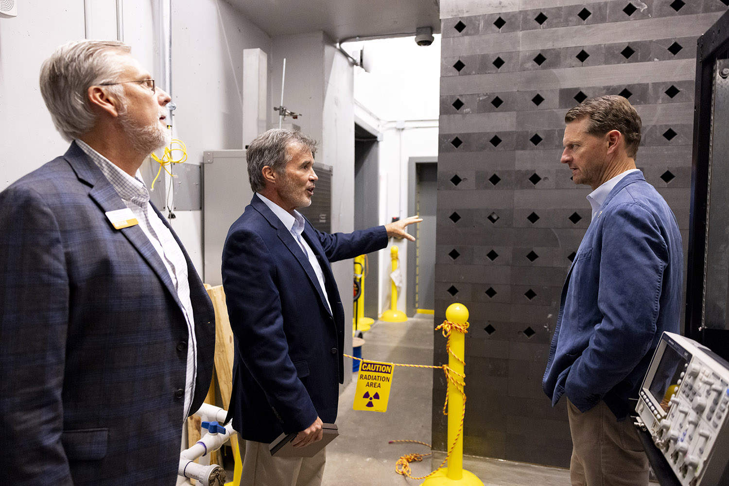 J. Wesley Hines, Postelle Professor and Chancellor's Professor, speaks with Tennessee Department of Economic and Community Development Commissioner Stuart C. McWhorter while taking a tour of the Zeanah Engineering Complex and Department of Nuclear Engineering at the University of Tennessee.