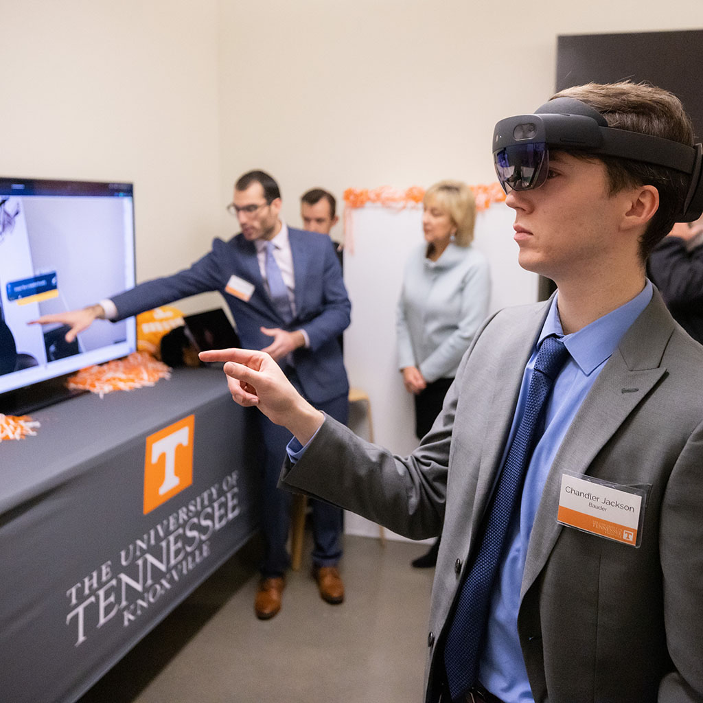 A student uses VR goggles during the AT&T 5G Lab grand opening.