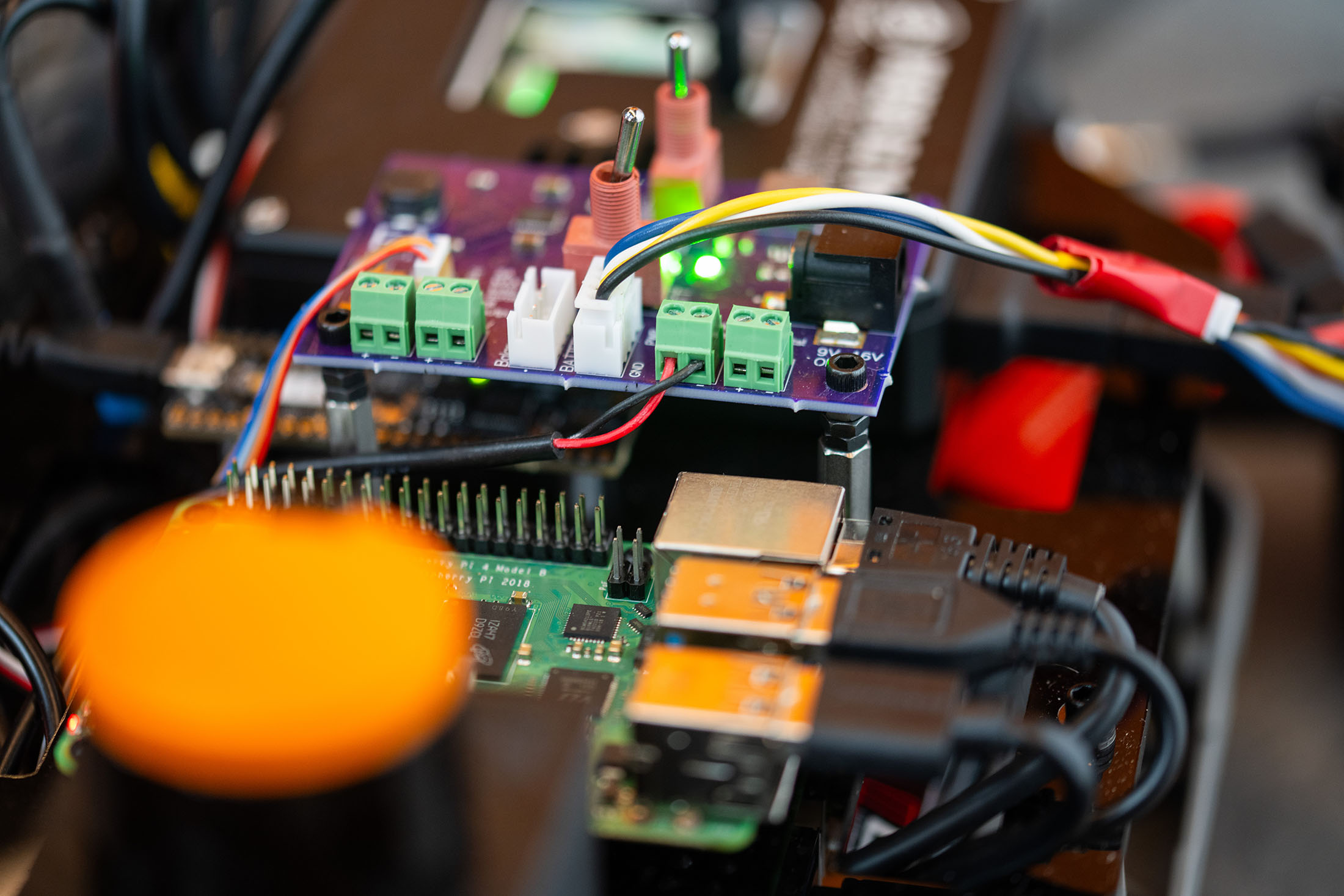 Close up of the circuitry inside an autonomous RC car.