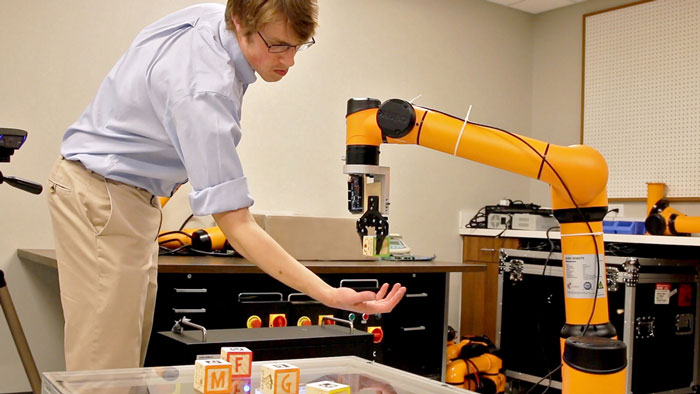 University of Tennessee mechanical engineering student Benjamin Terry demonstrates his team’s senior research project at AUBO Robotics at the Cherokee Farm Innovation Campus research park in Knoxville, Tennessee. The team added visual recognition capability to the industrial robot manufacturer’s existing AUBO-i5 robot.