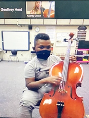 Student taking virtual cello lesson