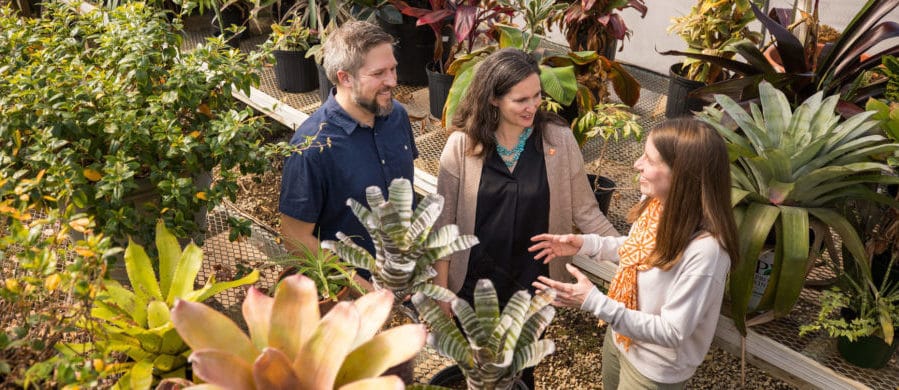 A connection between three professors has launched more than five years of multidisciplinary projects funded by the nation’s top research agencies. Jon Hathaway (left), Lisa Reyes Mason (middle), and Kelsey Ellis (right) discuss climate research.