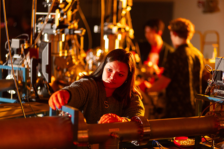 Several graduate students work in the Ion Beam Materials Lab