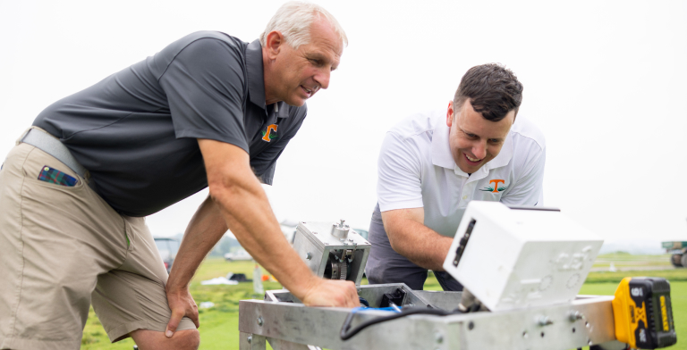 Distinguished Professor John Sorochan and Research Associate Kyley Dickson work with the fLEX Device on a turfgrass research plot at UT's East Tennessee AgResearch and Education Center.