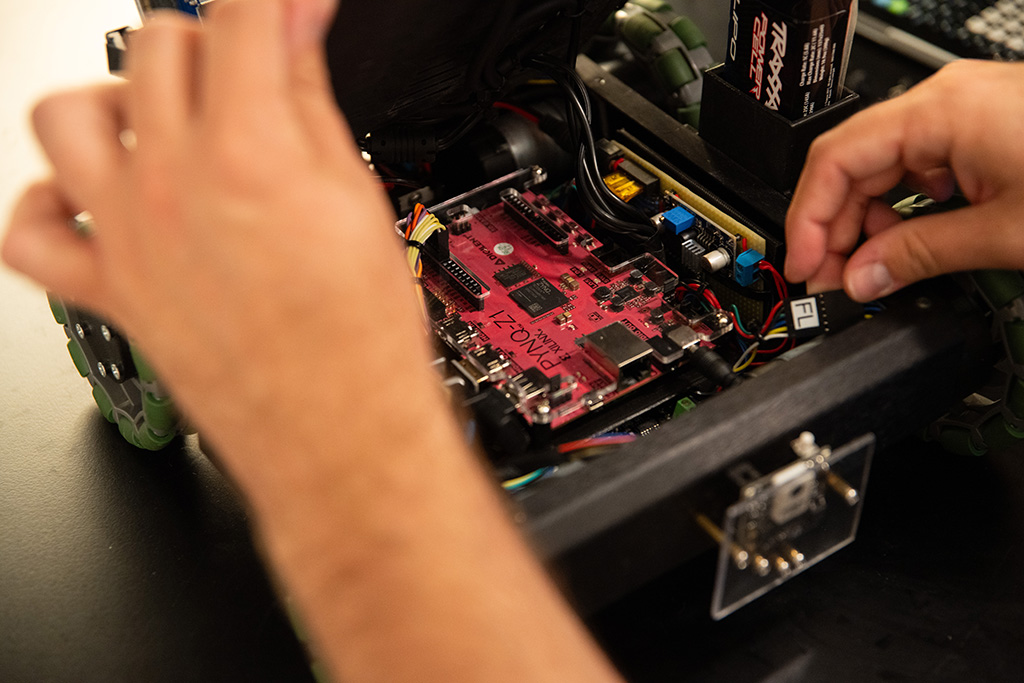 Close up of hardware inside a small autonomous vehicle.