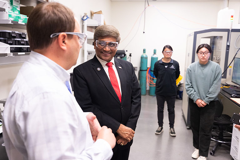 Dr. Sethuraman Panchanathan, NSF Director, speaks with Philip Stuckey, founder and CEO of FC Renew, which has lab space in UT’s Institute for Advanced Materials and Manufacturing.