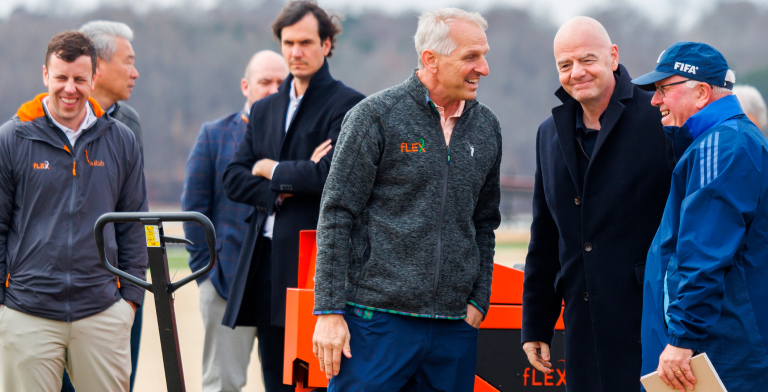 Distinguished Professor John Sorochan, center, talks with FIFA President Gianni Infantino and other attendees at the FIFA Pitch Research Field Day, where the fLEX Device was demonstrated.