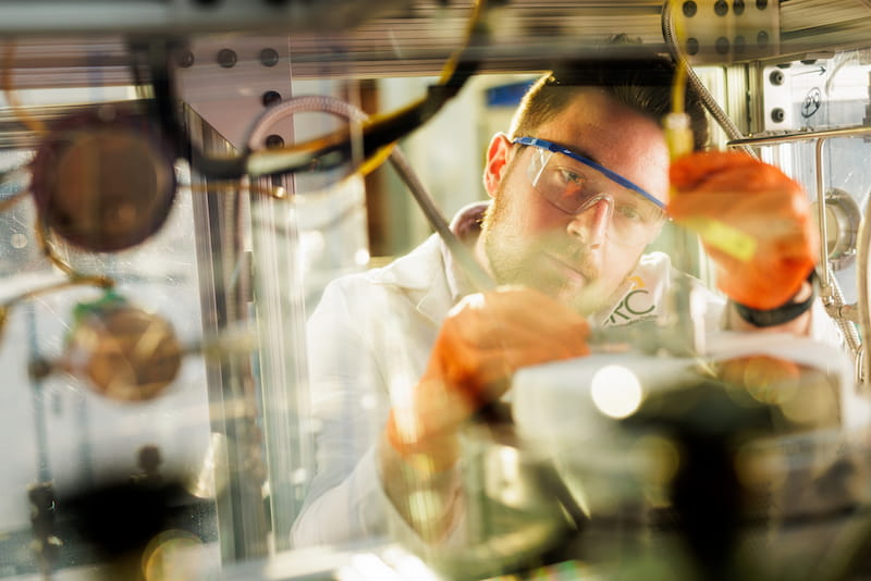 Researcher working with samples in bioenergy fuel laboratory