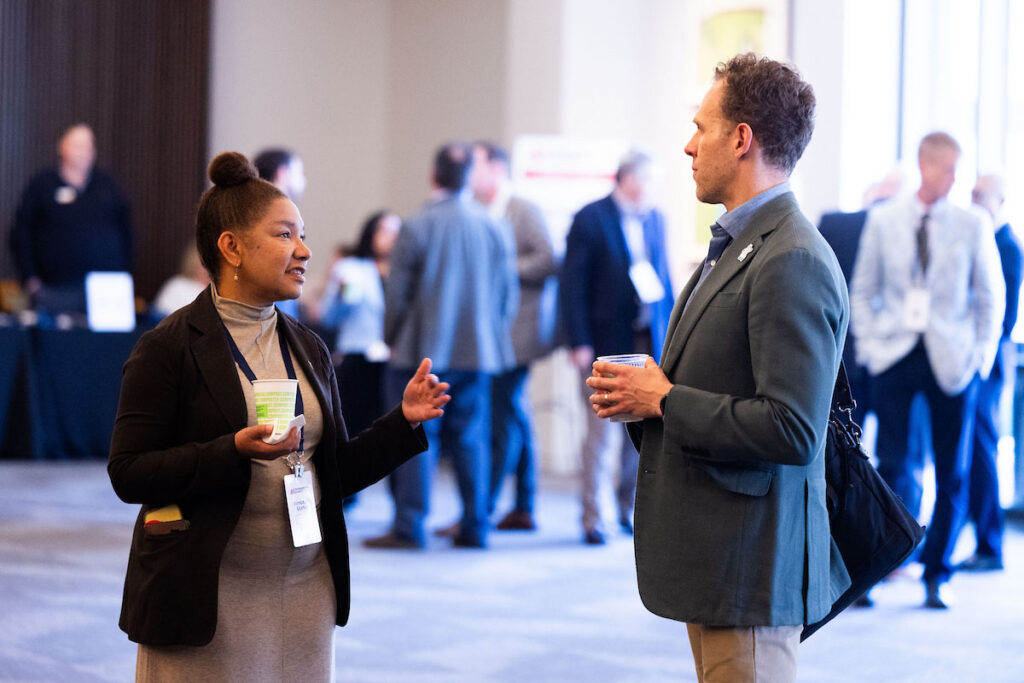 Attendees network during the AI Tennessee Summit at the Country Music Hall of Fame in Nashville.