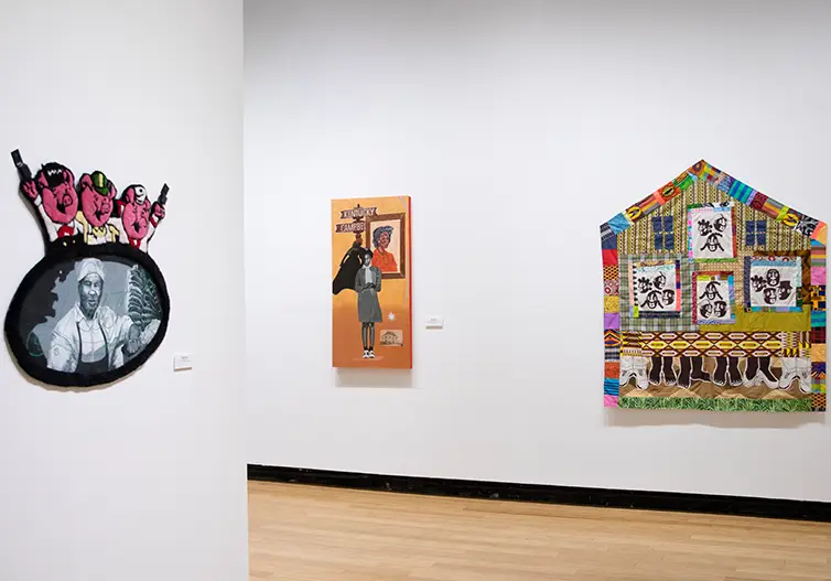Contemporary art gallery exhibition displaying mixed media artworks