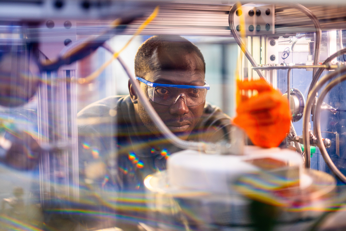 Nourredine Abdoulmoumine works on the CO2-to-jet fuel reactor in the Bioenergy and Biofuels Lab on the Ag campus